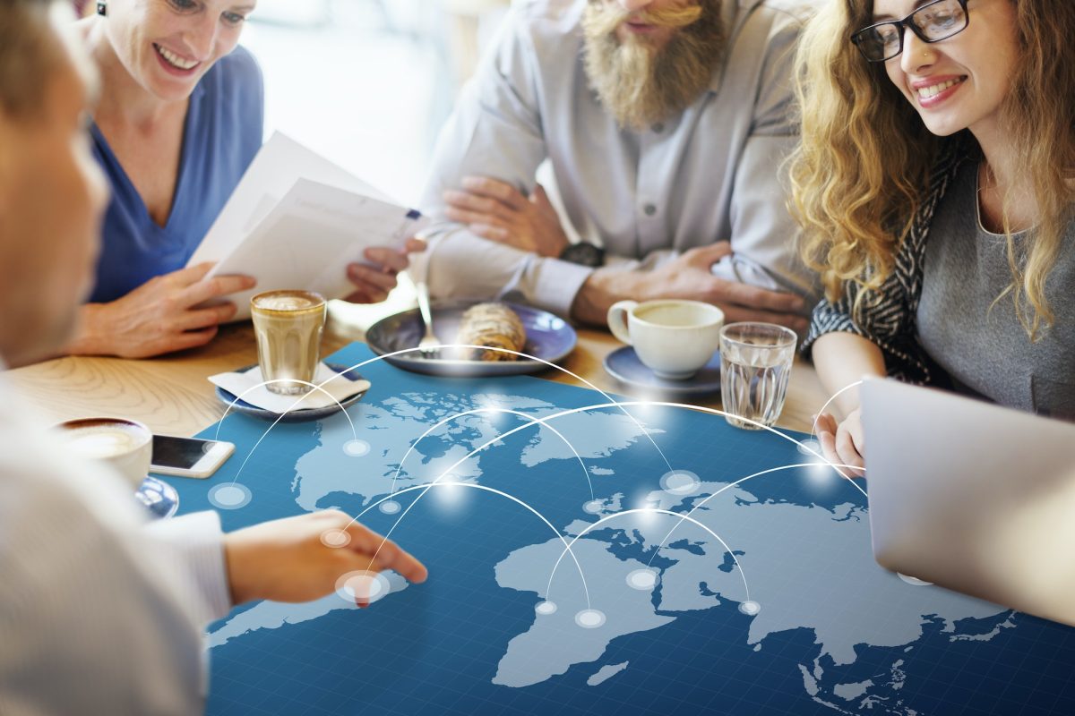 People having a discussion about a world map